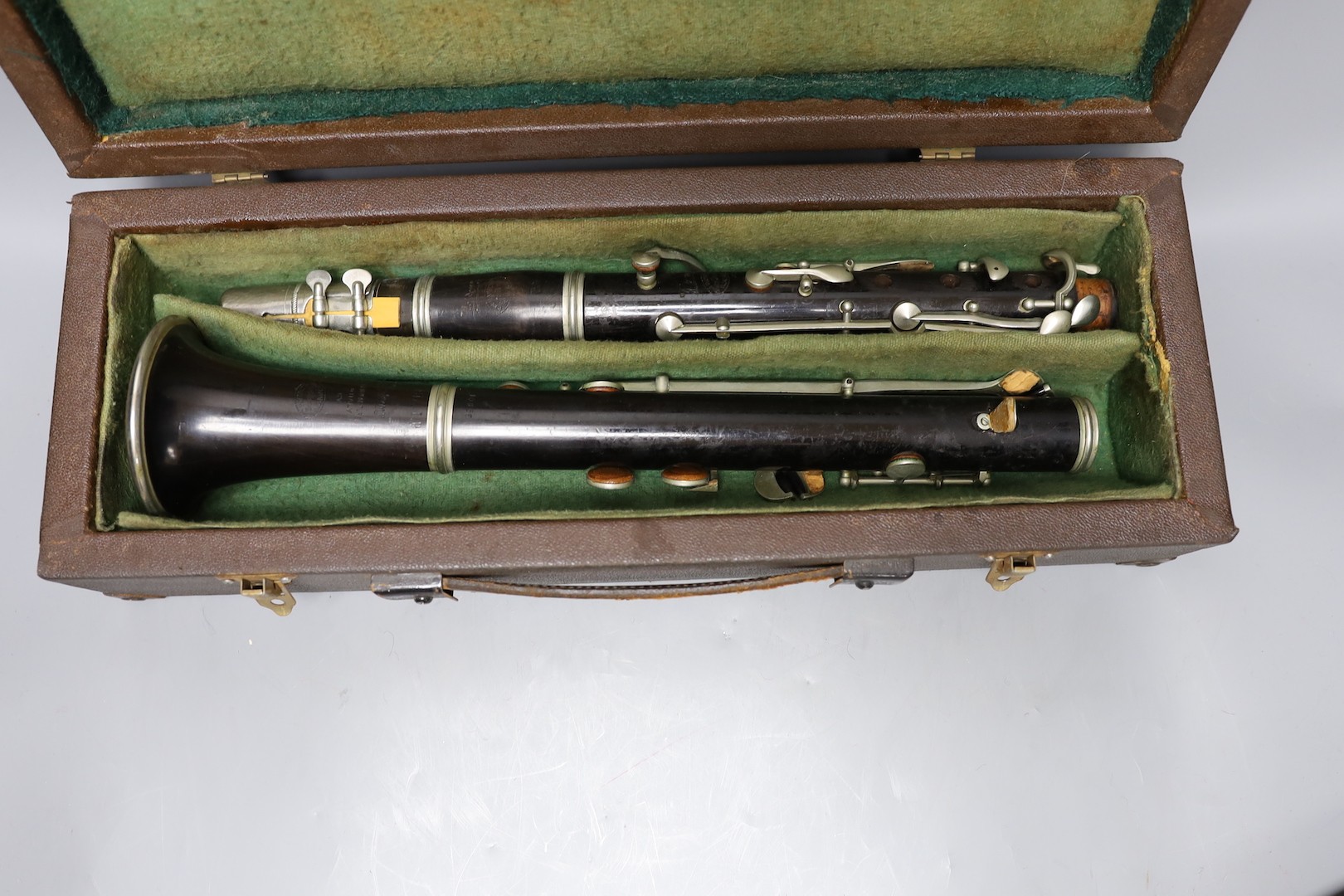 A ‘Superior Class’ Hawkes & Son clarinet and a cased Rampone and Cazzani ‘Judson’ ’ clarinet, 67 cm long.